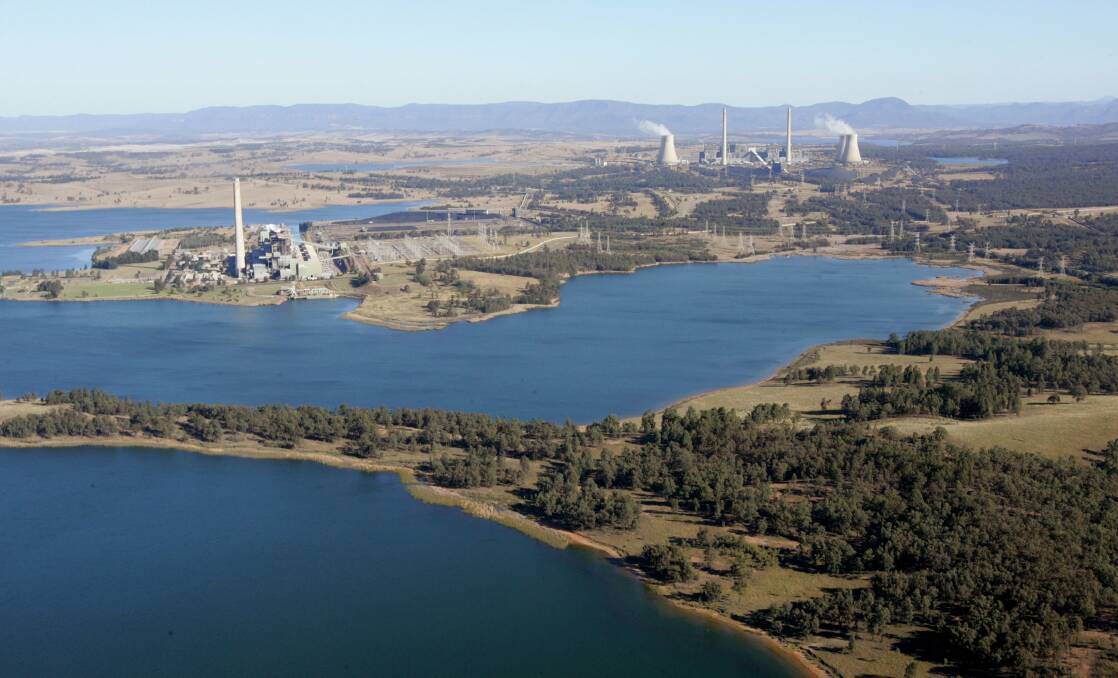 TWIN TOWERS: AGL's Liddell lake-cooled power station in the foreground, with the newer Bayswater power station, with its four cooling stations, on the other side of the New England Highway. Picture: Dean Osland