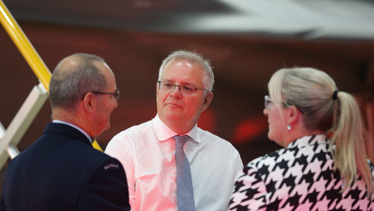 Air Marshal Mel Hupfeld and BAE Systems Australia chief Gabrielle Costigan with the PM. Picture: Jonathan Carroll