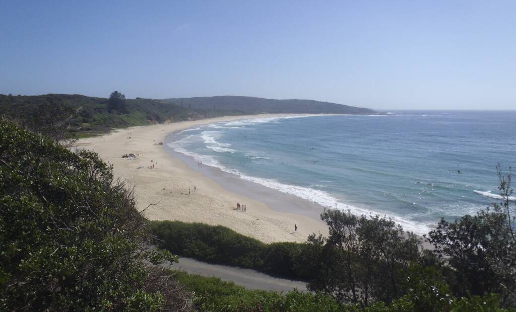 Looking north from the southern headland of Catherine Hill Bay towards Middle Camp in the bush at the northern end of the beach.