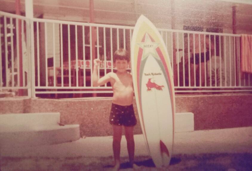 IN THE BEGINNING: A young Nicky Wood with his own brand new Mark Richards board. Notice the name in the centre of the star under the nose. It says 'Nicky'. Picture: Courtesy Rochelle Wood