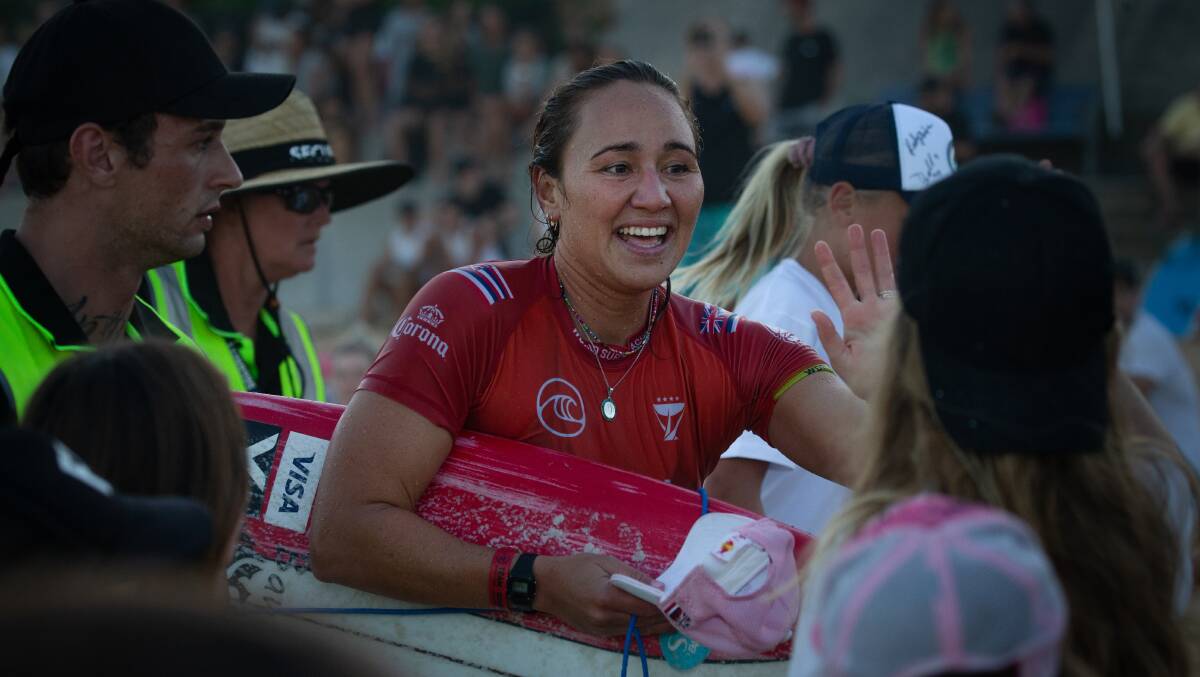 FAN FAVOURITE: Carissa Moore was mobbed on the sand after a performance that will find its place in the history of surfing. Picture: Marina Neil