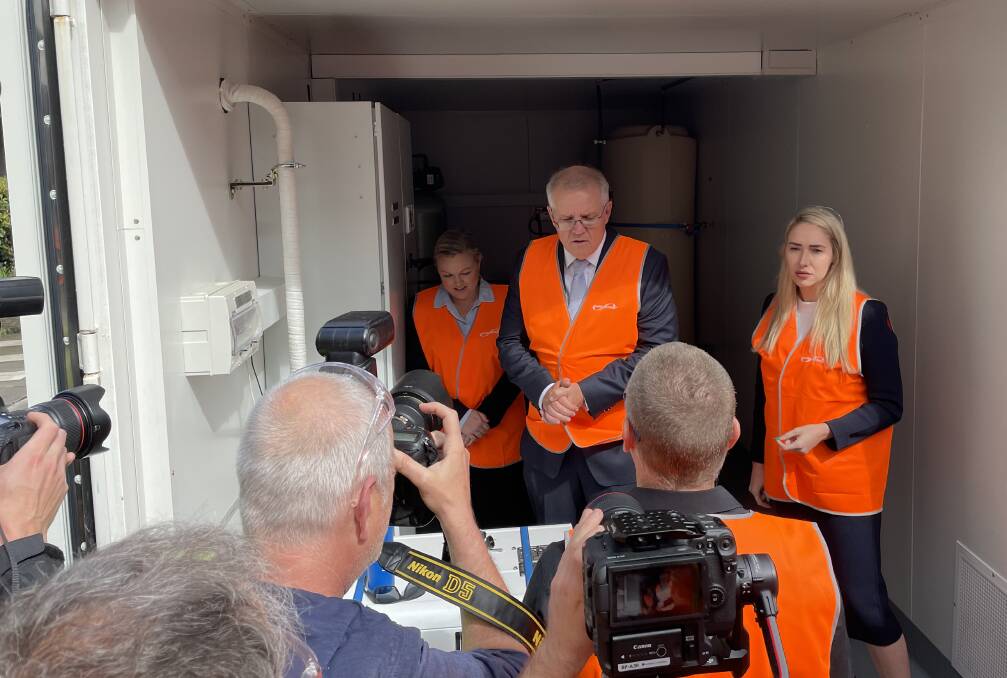 CANDIDATE CALL: Prime Minister Scott Morrison at Ampcontrol Tomago today with the Liberal Party's candidate for Shortland, Nell McGill, left, and Paterson candidate Brooke Vitnell, right.