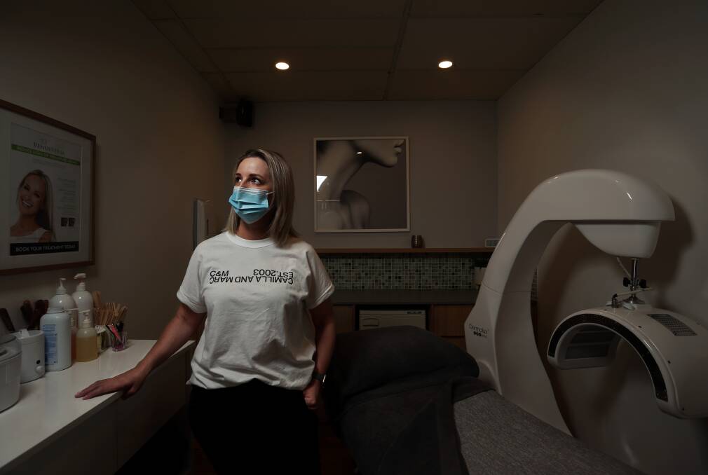 As we reopen the shutters, the road to 'new normal' will be anything but certain. Beauty salon owner Michelle Groves, last month. Picture: Simone De Peak
