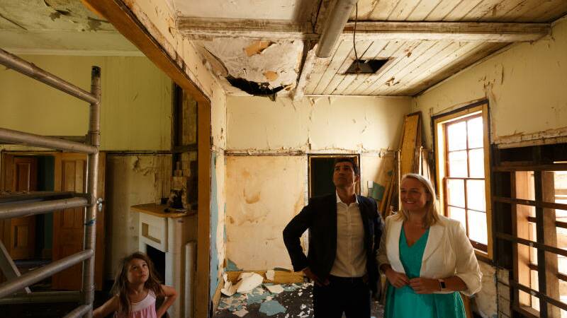 Newcastle Lord Mayor Nuatali Nelmes with council chief executive Jeremy Bath in the cottage in 2017, before repairs began