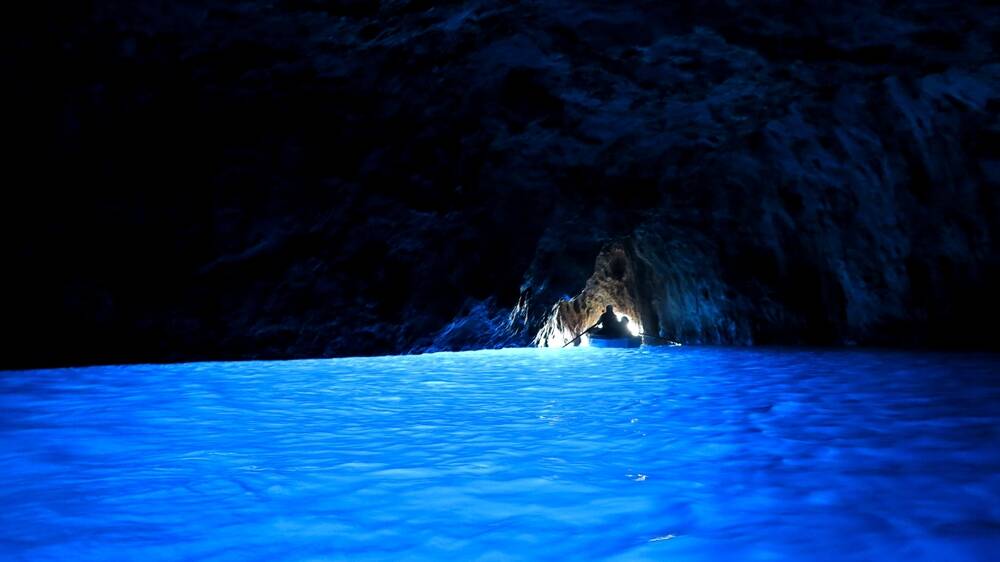 The light that shines in makes the Blue Grotto seem eerily electrified