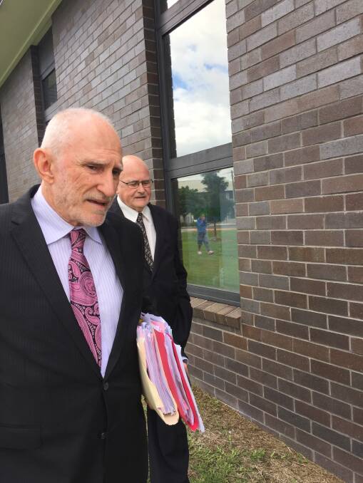 Solicitor Foate and Father Barry Tunks (behind) after briefly appearing in Forster Local Court on Wednesday, April 5.