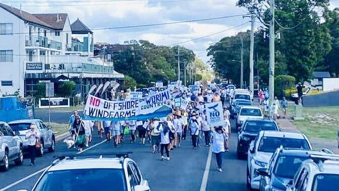 Many of the community's 4000 residents rallied in the streets of Hawks Nest. Picture supplied. 