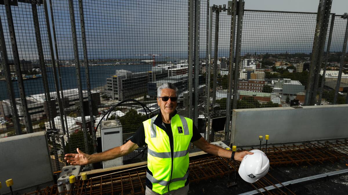 RISING ABOVE: Warwick Miller standing on the 15th floor of the Verve apartments during construction in King Street. Picture: Jonathan Carroll