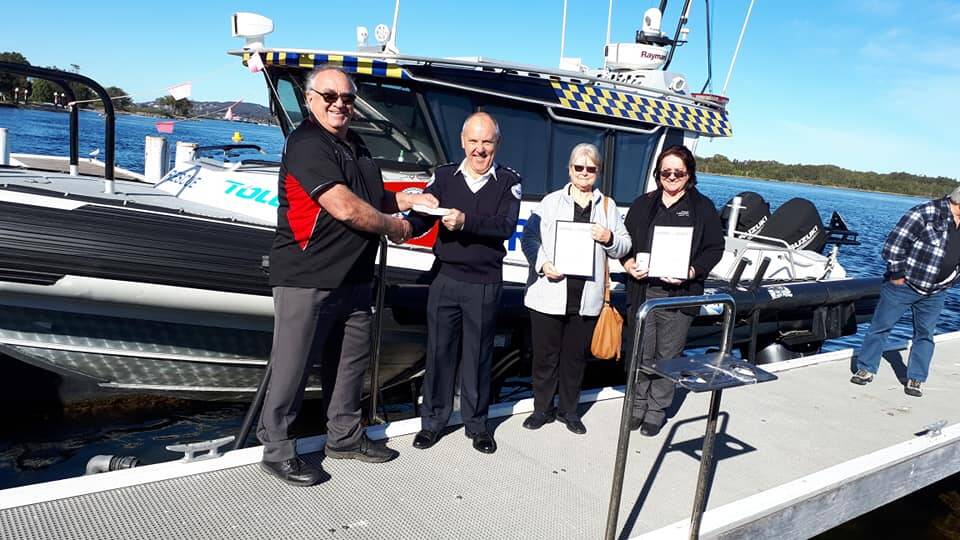 GOOD WORK: Members of Teralba Lakesiders Fishing Club present a cheque for $1500 to Lake Macquarie Marine Rescue on Thursday.