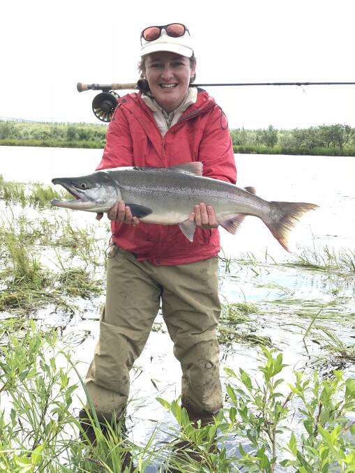 SOCK IT TO YA: Candice Anderson with her sockeye salmon caught on the fly in Alaska.