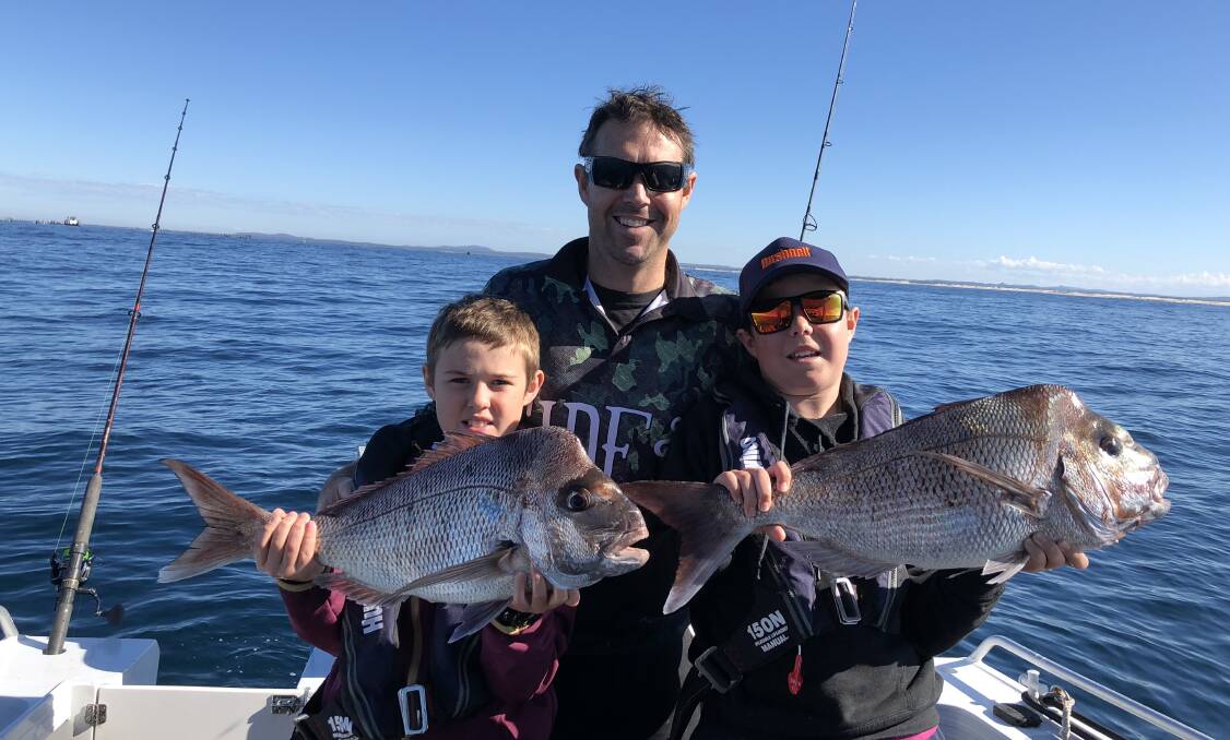 FISH OF THE WEEK: Twins Henry and Hunter O'Neill with father Michael win the prize this week for twin snappers each caught off Broughton island recently.