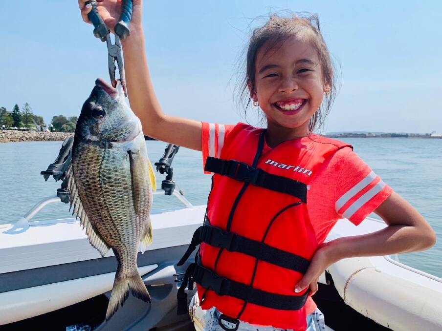 
FISH OF THE WEEK: Seven-year-old Alana Tran from New Lambton wins the Jarvis Walker tacklebox and Tsunami lure pack for this 39cm bream fishing near Stockton boat ramp last Sunday. 