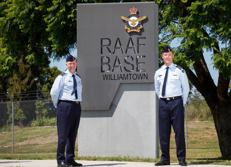 PROUD COMMANDER: Senior Australian Defence Force Officer (SADFO), RAAF Base Williamtown, Group Captain Anthony Stainton, left, took over command from SADFO, Group Captain Peter Cluff in January this year. Picture: CPL Melina Young