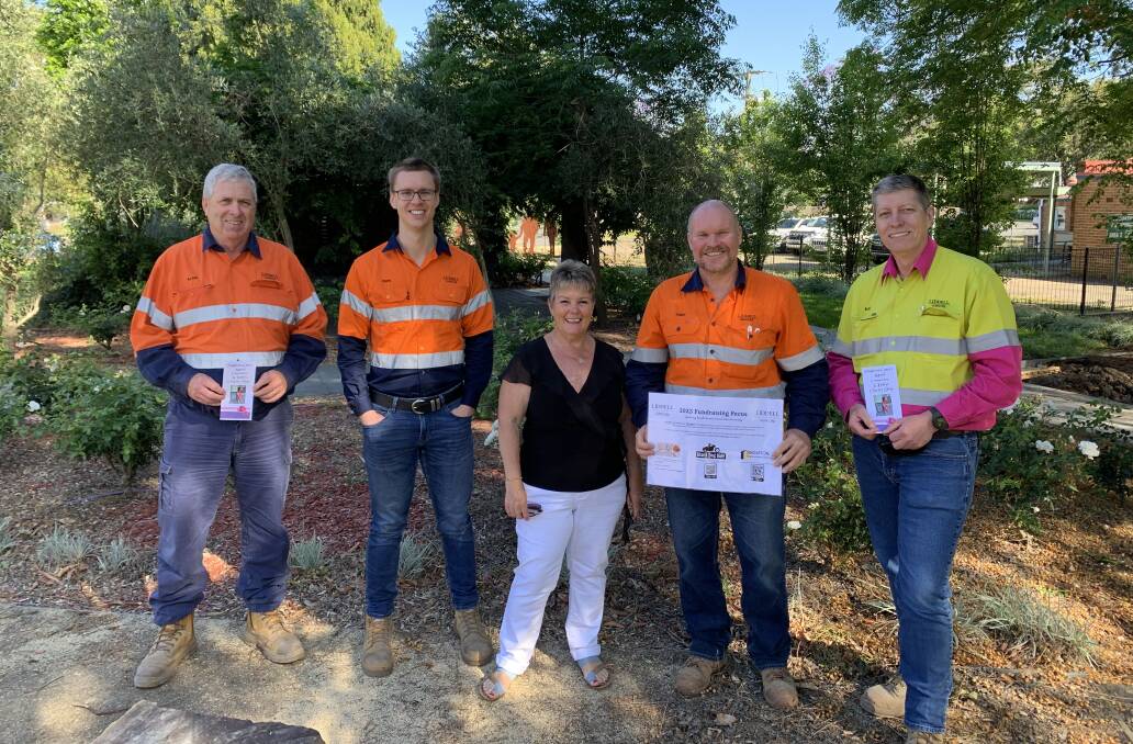 Liddell Coal Operations employees donate $12,000 to local charities including Singleton Cancer Appeal. Pictured is Kay Sullivan and representatives from the mine.