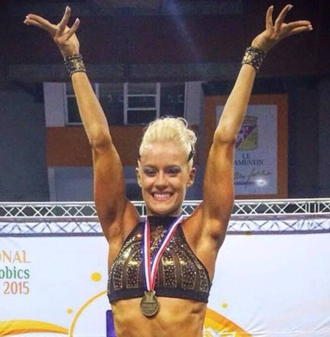 Proud: Newcastle's Allira Bull claims gold at the Federation of International Sport Aerobics and Fitness 2015 World Championships.
