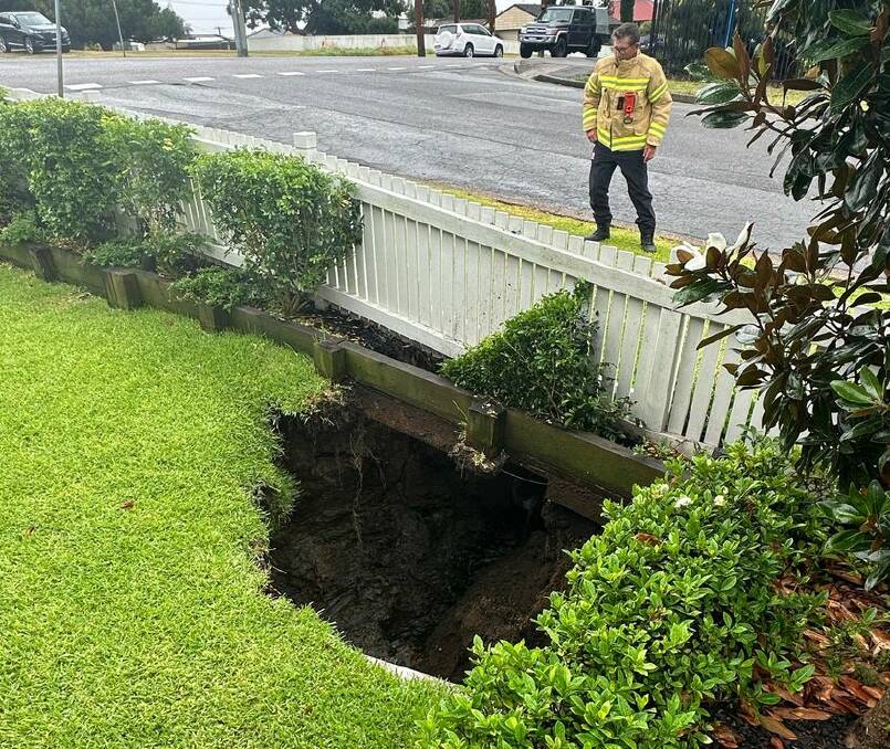 The sink hole opened up after heavy downpours across the Hunter. Picture by NSW Fire and Rescue 