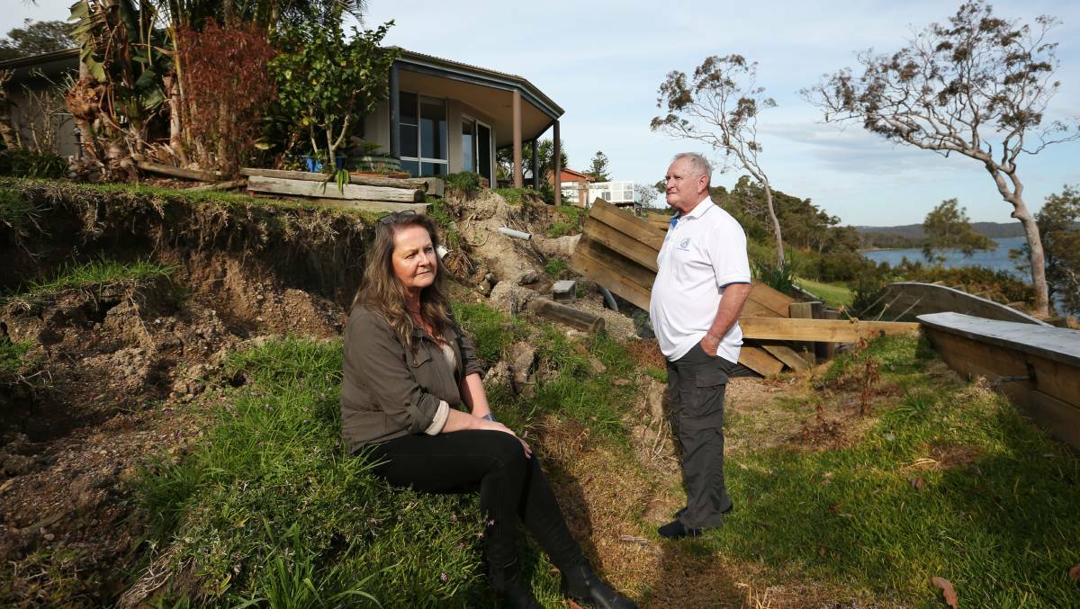 Frustrated neighbours Shirley Vaughan and Danny Winter at the landslip site. Picture by Simone De Peak