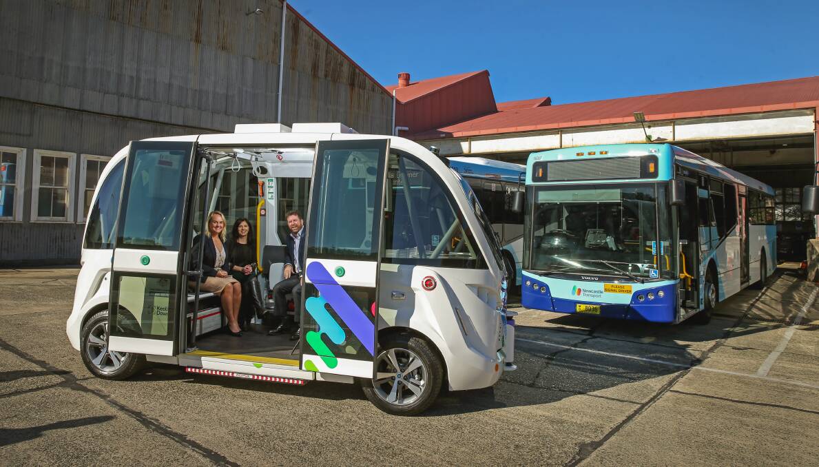 NEW: Lord Mayor of Newcastle Nuatali Nelmes, Keolis Downer's Sue Wiblin and general manager Mark Dunlop inside the new vehicle. Picture: Marina Neil