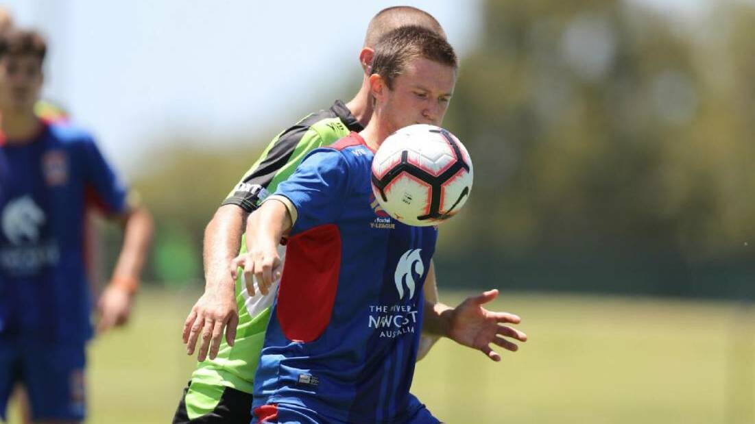 ON THE BALL: Kent Harrison in action for the Newcastle Jets Youth team. Picture: Grant Sproule