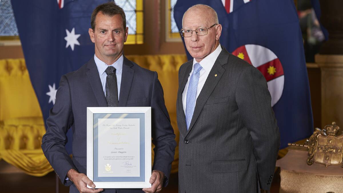 Grant Huggins is one of the recipients of the Royal Life Saving Society Australia (NSW) Commendation Awards. Here he is at Government House in Sydney on Tuesday with Governor of New South Wales, David Hurley. Picture: Rob Tuckwell Photography