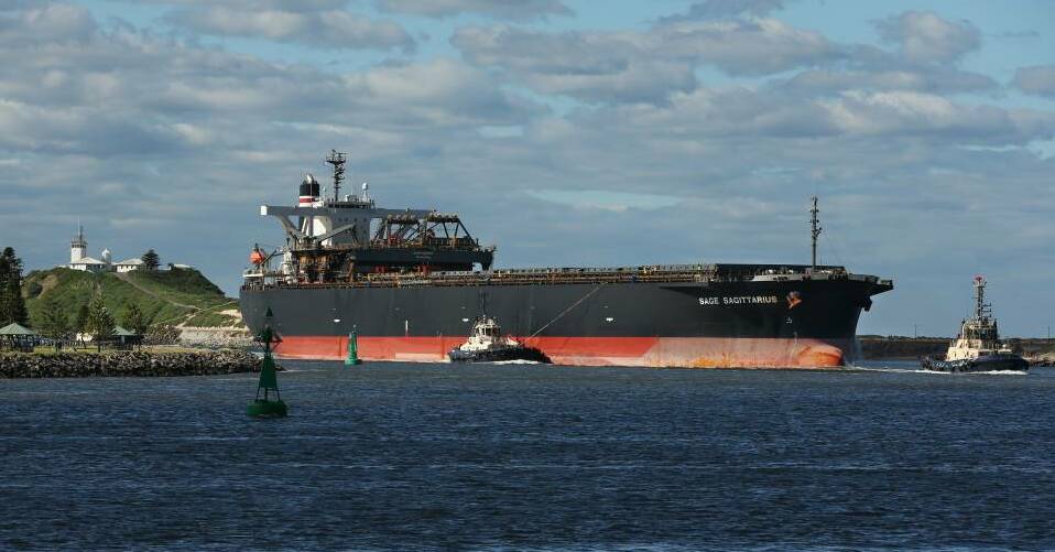 A ship enters the port, passing the Stockton shore, left. Picture by Simone De Peak