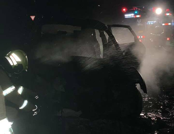 STOCKTON: Firies work to douse the car fire. Picture: Fire and Rescue NSW Stockton