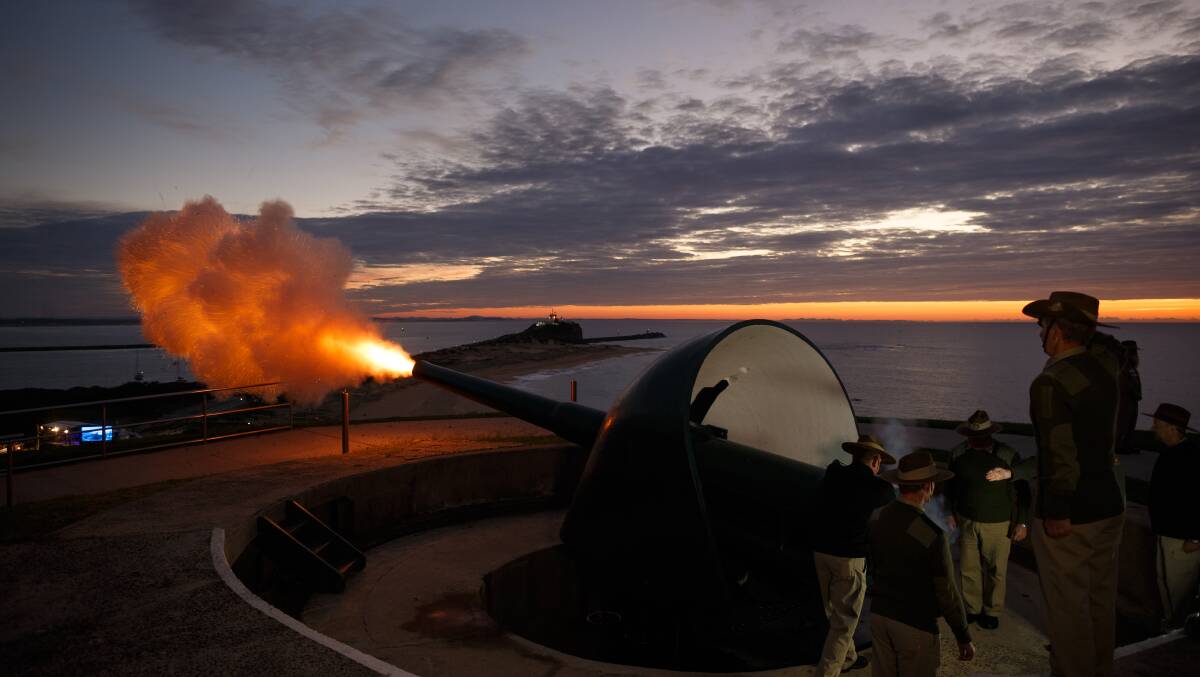 HILL: The cannon being fired at Fort Scratchley at the end of the Anzac Day ceremony. Picture: Max Mason-Hubers 