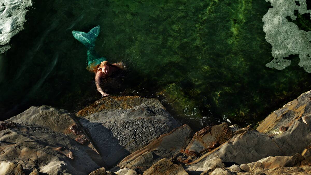 SWIM: Mermaid Merella also known as Emily McAlpin enjoying the Bogey Hole in Newcastle. Picture: Simone De Peak