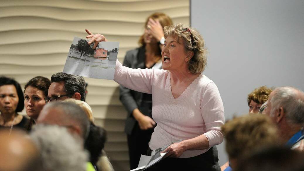 Defence and the EPA hold a community meeting at the Mulrook Culture Centre on Tuesday evening, where residents demanded answers to their contamination plight. Photos: Marina Neill