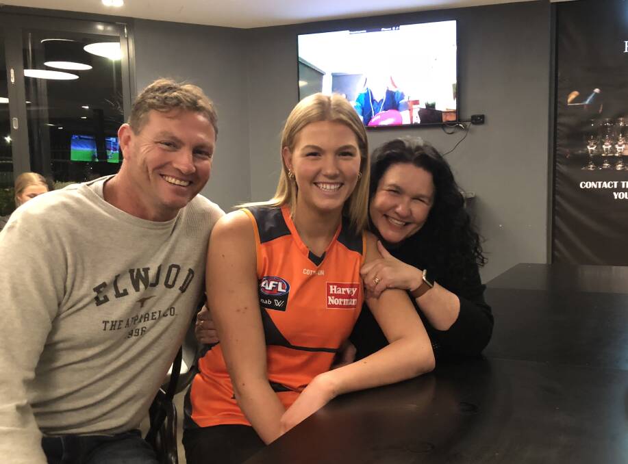 ALL SMILES: Wagga's Ally Morphett, flanked by her parents Paul and Rebecca, at the Kooringal Hotel in Wagga on Tuesday night after hearing her name called by the Greater Western Sydney (GWS) Giants in the AFL Women's Draft. Picture: Matt Malone
