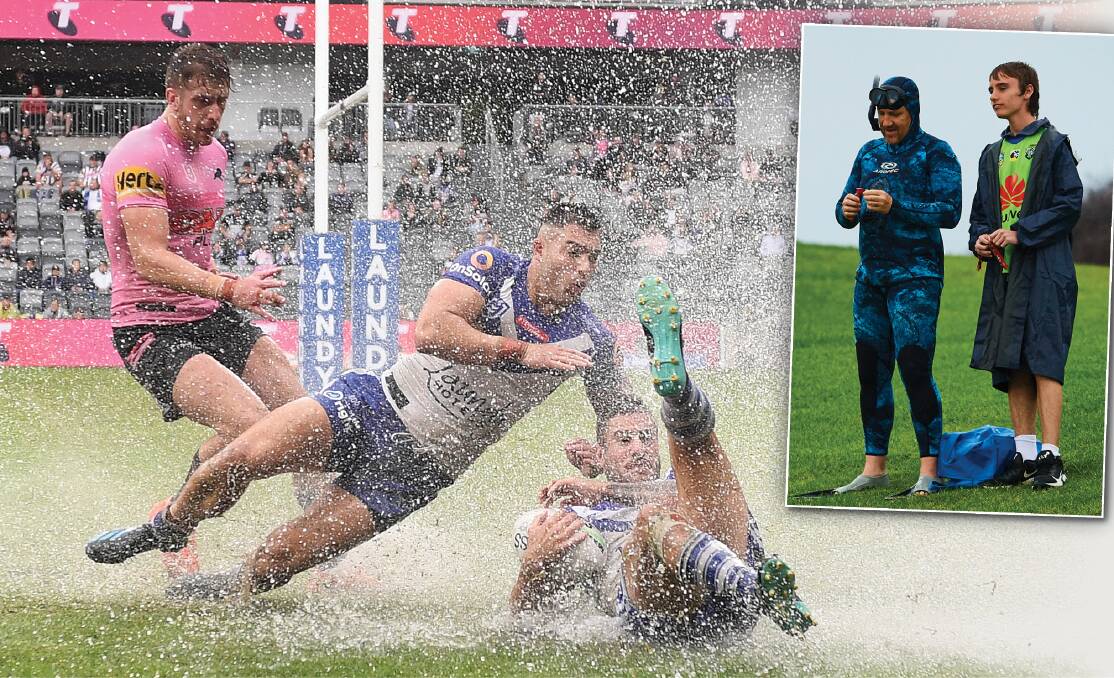 RAINING SUPREME: Most games in round two were played in torrential conditions, prompting one spectator at Kogarah to wear his scuba-diving equipment. Pictures: Getty Images