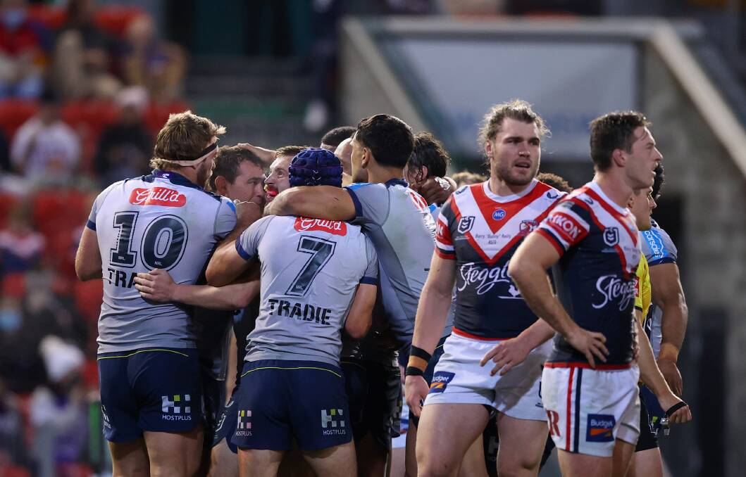 TRY TIME: The Storm celebrate as the scoreline mounts against the Roosters. Picture: Getty Images