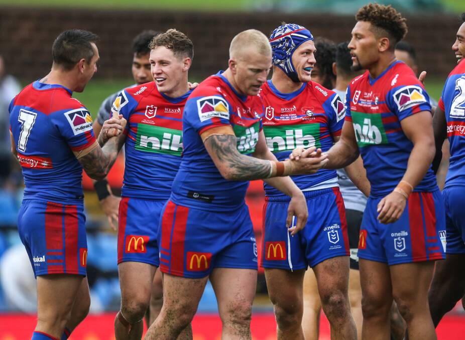 FIRST BLOOD: The Knights celebrate their season-opening win against the Warriors. It was the first time in six years Newcastle had kept an opponent scoreless.