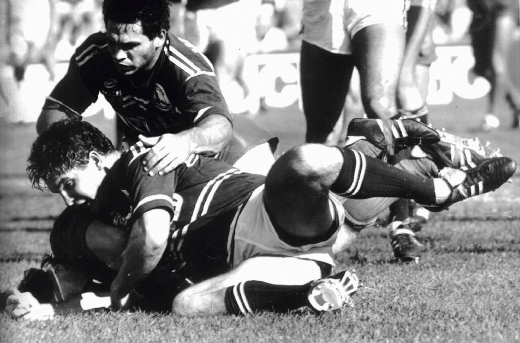 FLASHBACK: Tony Townsend scores for the Knights against Manly in the 1988 Herald Challenge Cup. 