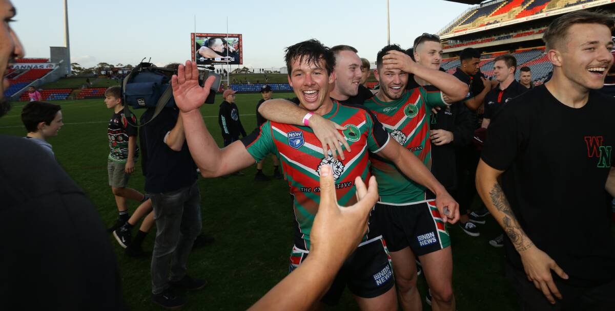 HIGH AND MIGHTY: Wests players celebrate their 36-0 triumph against Cessnock in Sunday's Newcastle Rugby League grand final. Picture: Jonathan Carroll