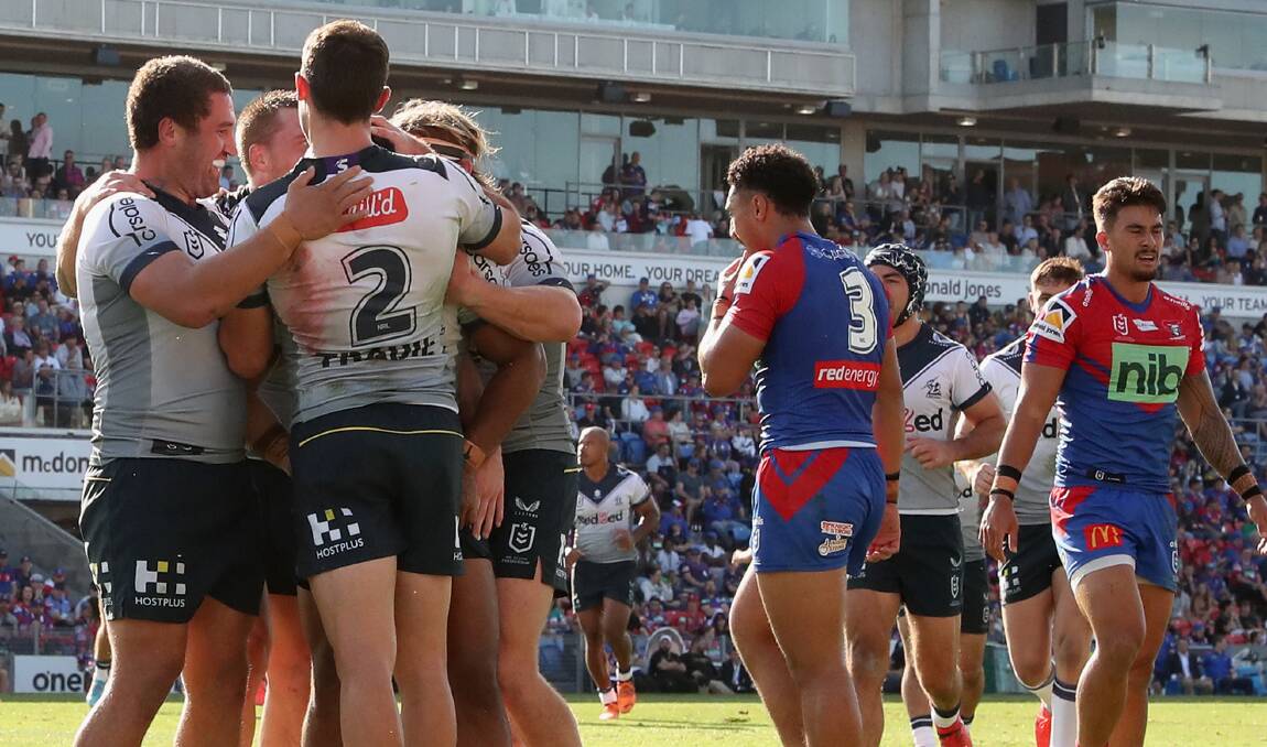 STORM DAMAGE: Melbourne celebrate another try in last week's 50-2 hammering of Newcastle at McDonald Jones Stadium. Picture: Getty Images