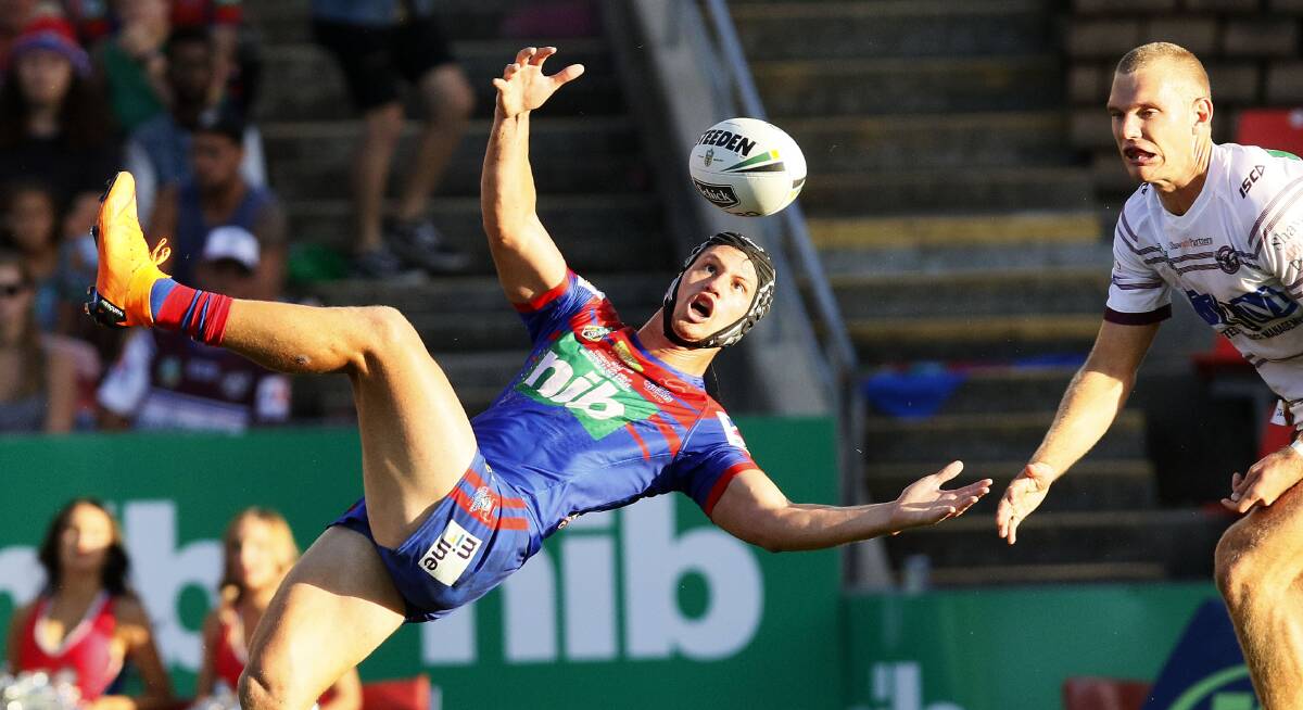 HAVING A BALL: Kalyn Ponga produced a juggling act before catching this one in last week's golden-point win against Manly. Picture: Darren Pateman, AAP