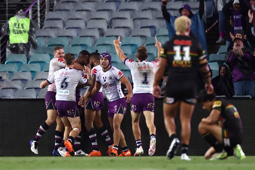 TRY TIME: Melbourne players celebrate Suliasi Vunivalu's intercept. Picture: Getty Images