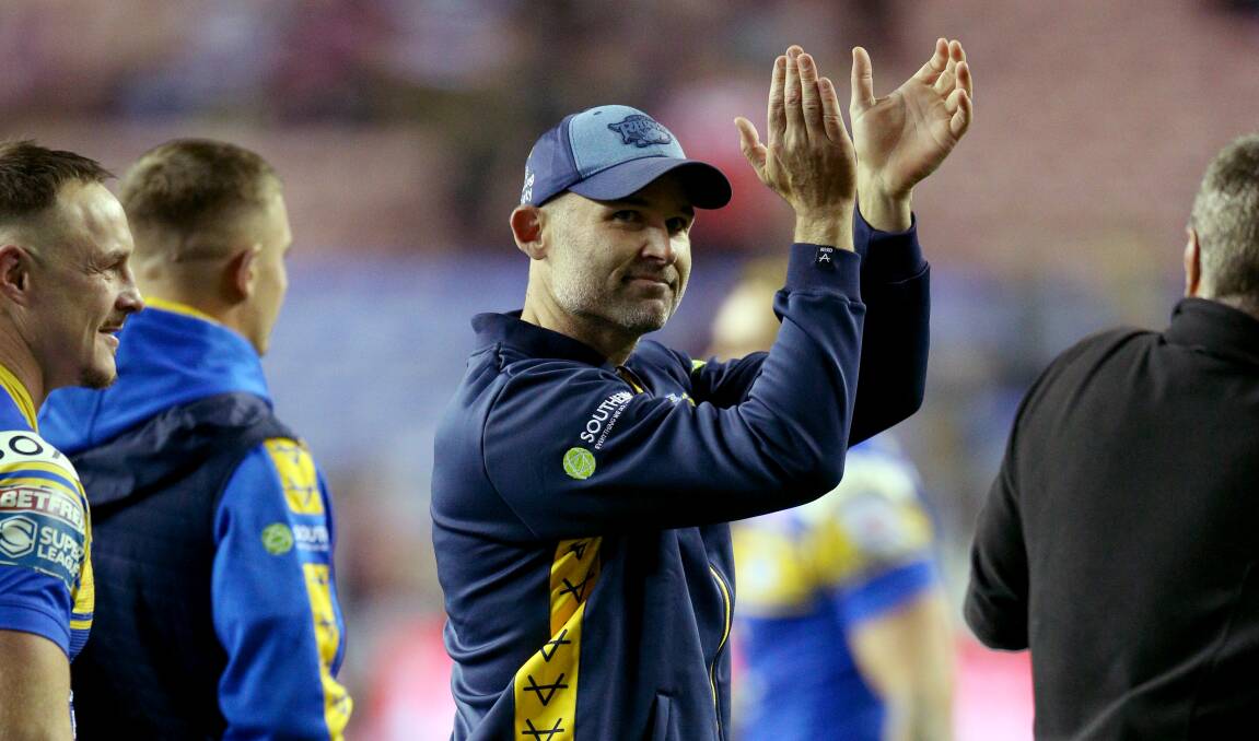 Leeds Rhinos coach Rohan Smith salutes the fans.