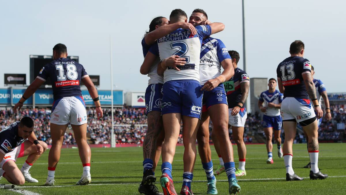 TRY TIME: Canterbury players congratulate Jacob Kiraz after scoring the first of his tries against Newcastle on Sunday. Picture: Getty Images