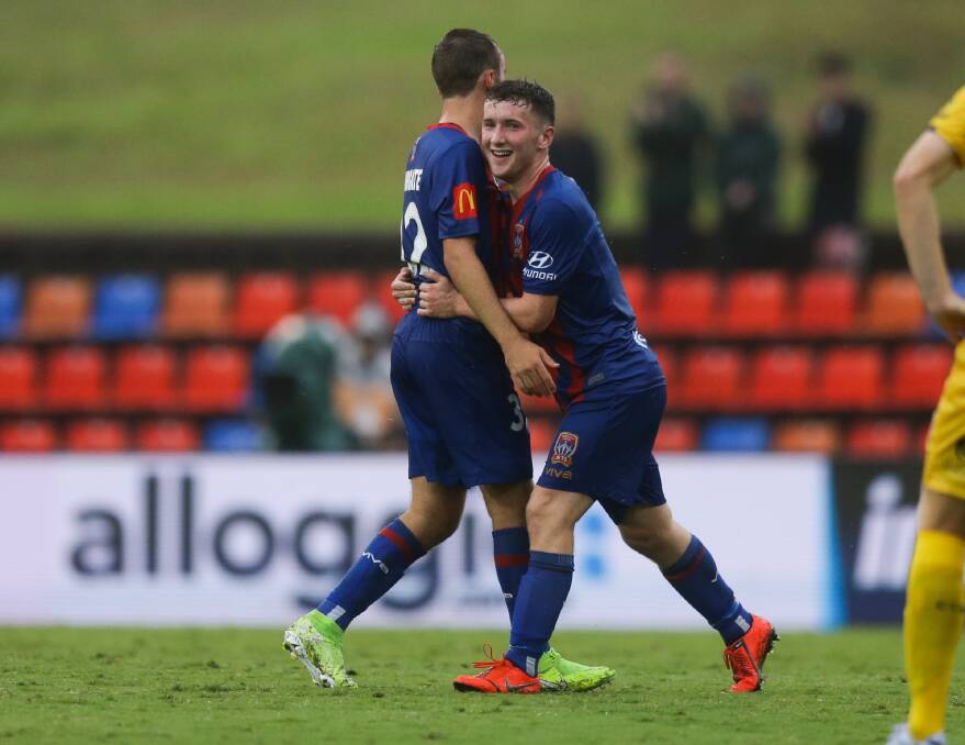 WINNERS ARE GRINNERS: Bobby Burns congratulates Angus Thurgate after Sunday's 4-3 victory against the Mariners. Picture: Jonathan Caroll
