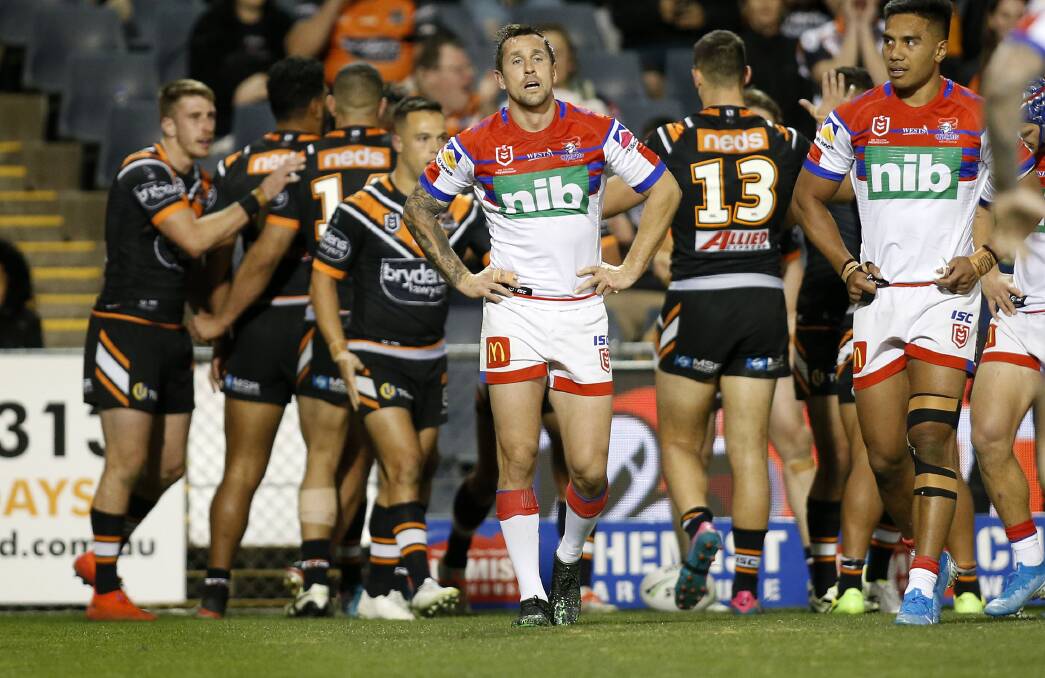 SAD STATE OF AFFAIRS: Newcastle players show their disappointment as the scoreline mounts against Wests Tigers last weekend. Picture: Darren Pateman, AAP