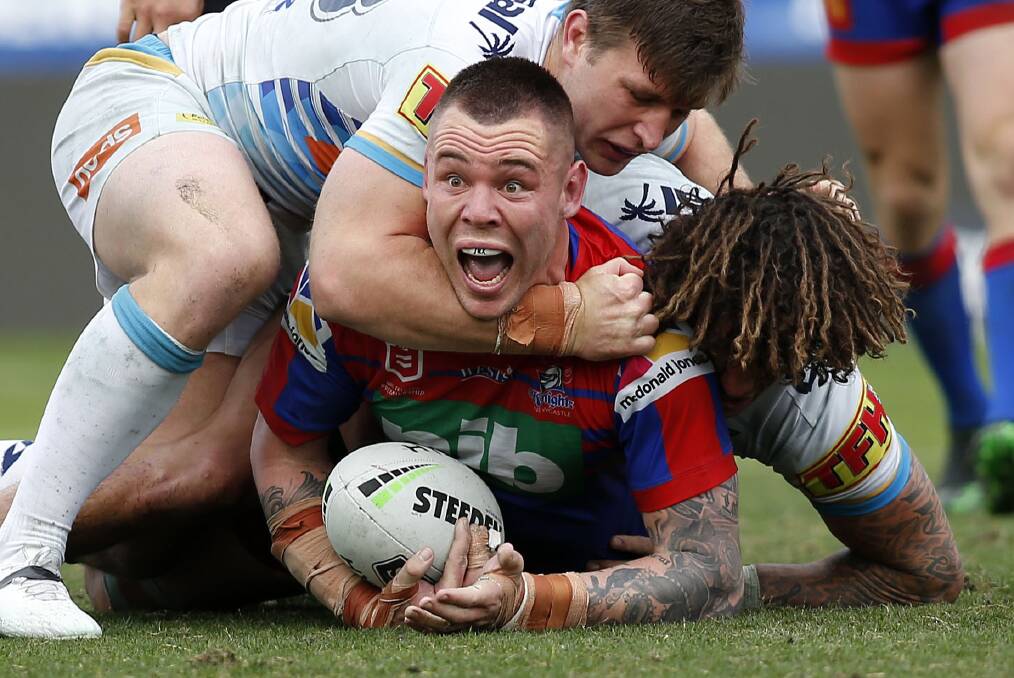 NO HOLDS BARRED: Newcastle prop David Klemmer appeals to the referee after Gold Coast lock Jai Arrow uses a wrestling move in a tackle at McDonald Jones Stadium on Saturday. Picture: Darren Pateman, AAP