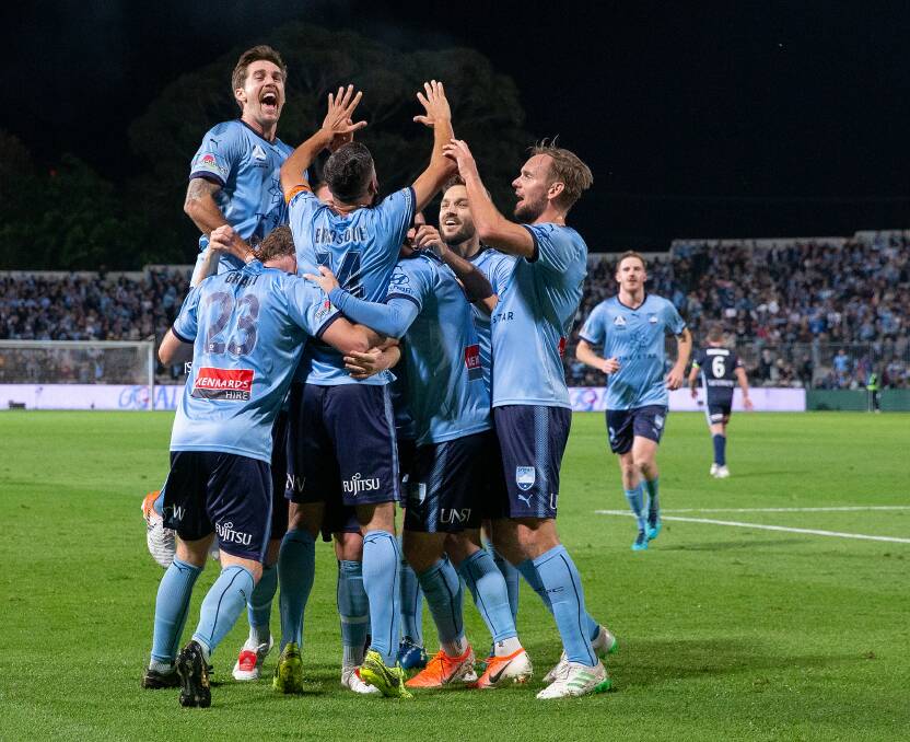 PARTY TIME: Sydney celebrate after an Alex Brosque goal in the 6-1 drubbing of Melbourne Victory in the grand final qualifier. Picture: AAP