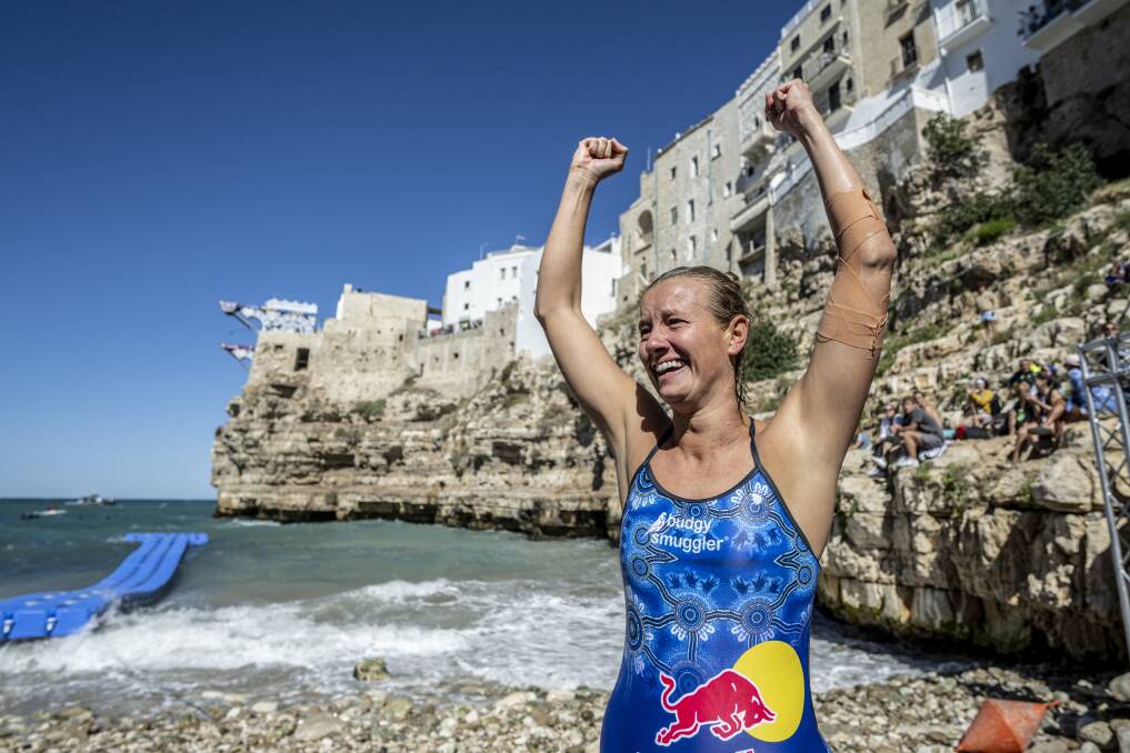 Lake Macquarie's Rhiannan Iffland is overcome with emotion after clinching her sixth successive Red Bull cliff-diving world title, at Polignano a Mare in Italy. Picture by Dean Treml, red Bull Content Pool