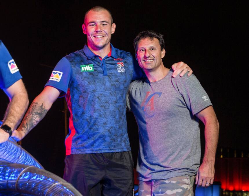 BLUE BROTHERS: A chance meeting between NSW Origin prop David Klemmer and former coach Laurie Daley at Honeysuckle last week. Picture: Marina Neil