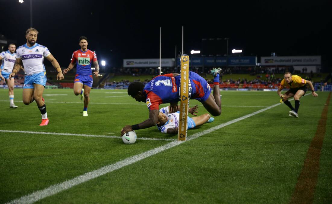 TRY TIME: Newcastle's Edrick Lee
scores against Gold Coast on Friday
night. Picture: JONATHAN CARROLL