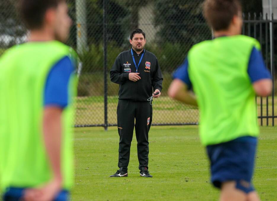 CLOSE WATCH: New Newcastle Jets coach Arthur Papas oversees a training session at Speers Point on Wednesday. Pictures: Max Mason-Hubers 