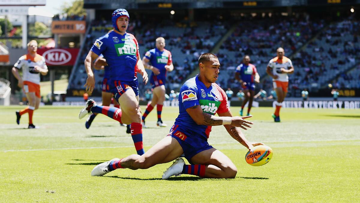 TRY: Newcastle's Ken Sio scores against Wests Tigers.