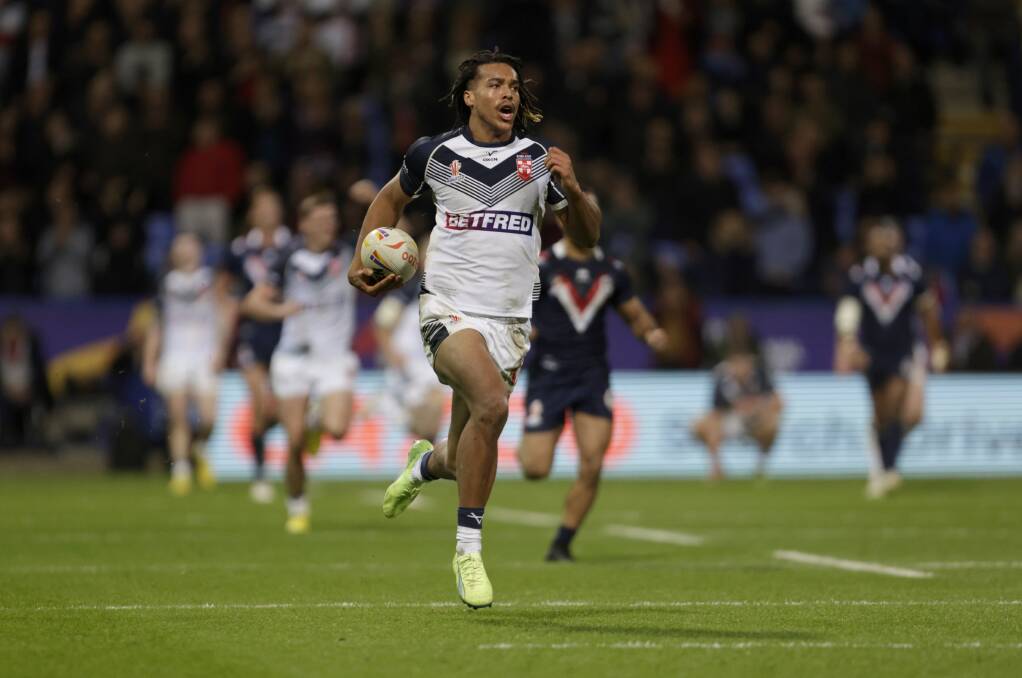 England winger Dominic Young on his way to a runaway try against France. Picture Getty Images